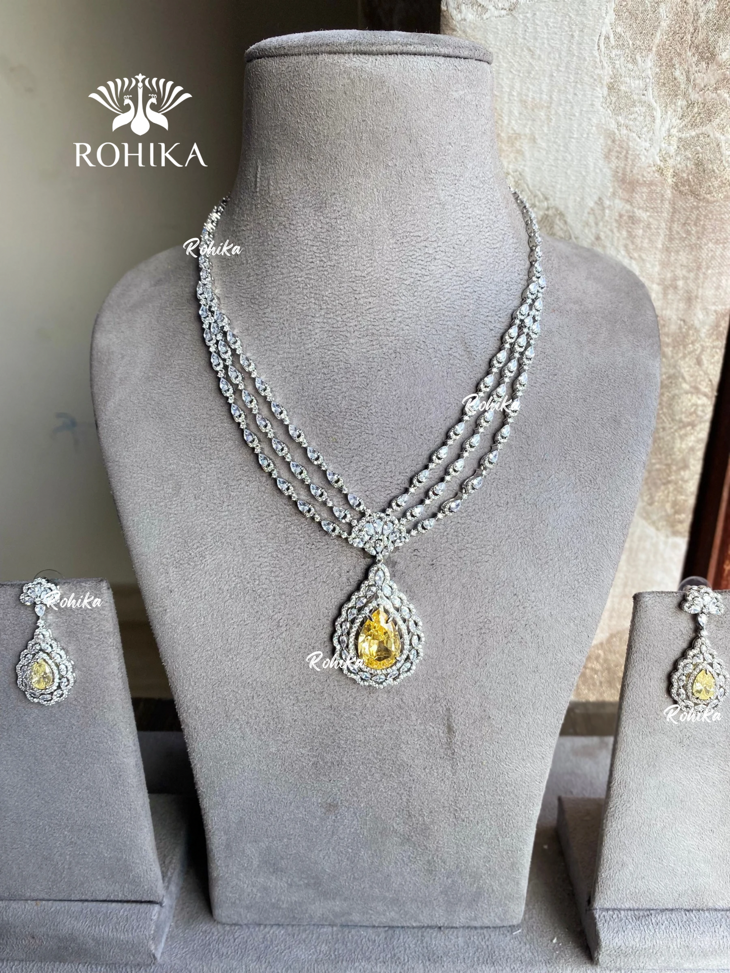 Siyara american diamond necklace set - Yellow