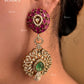 Pink and green color kundan necklace set on a grey dummy